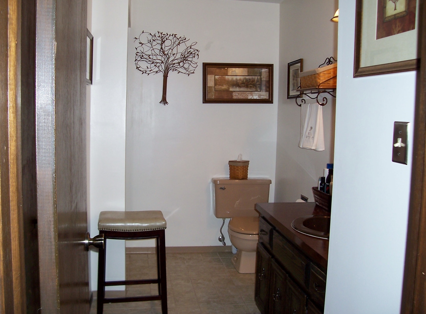 411 Lemont Street Lemont, IL 60439 - Photo 18 of 31 a view of a hallway with paintings on the wall