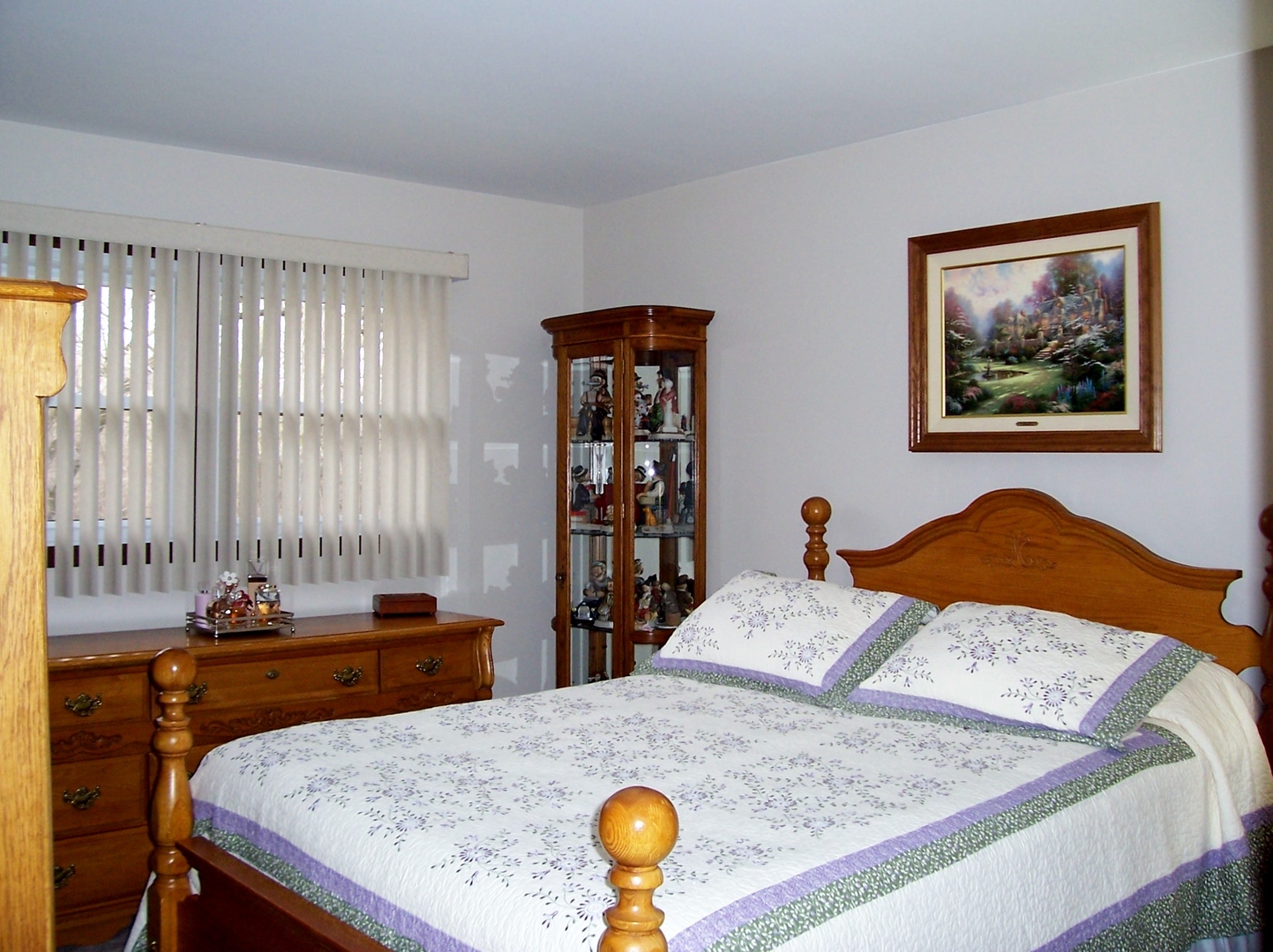 411 Lemont Street Lemont, IL 60439 - Photo 19 of 31 a bedroom with a bed and furniture