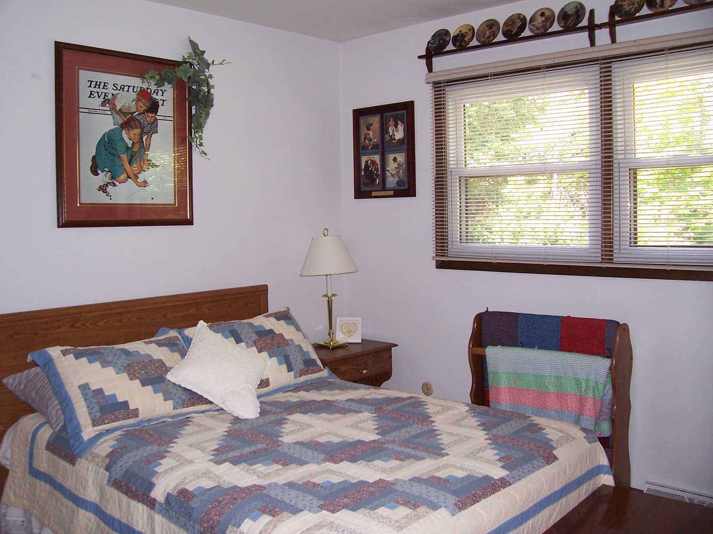 411 Lemont Street Lemont, IL 60439 - Photo 21 of 31 a bed sitting in a bedroom next to a window