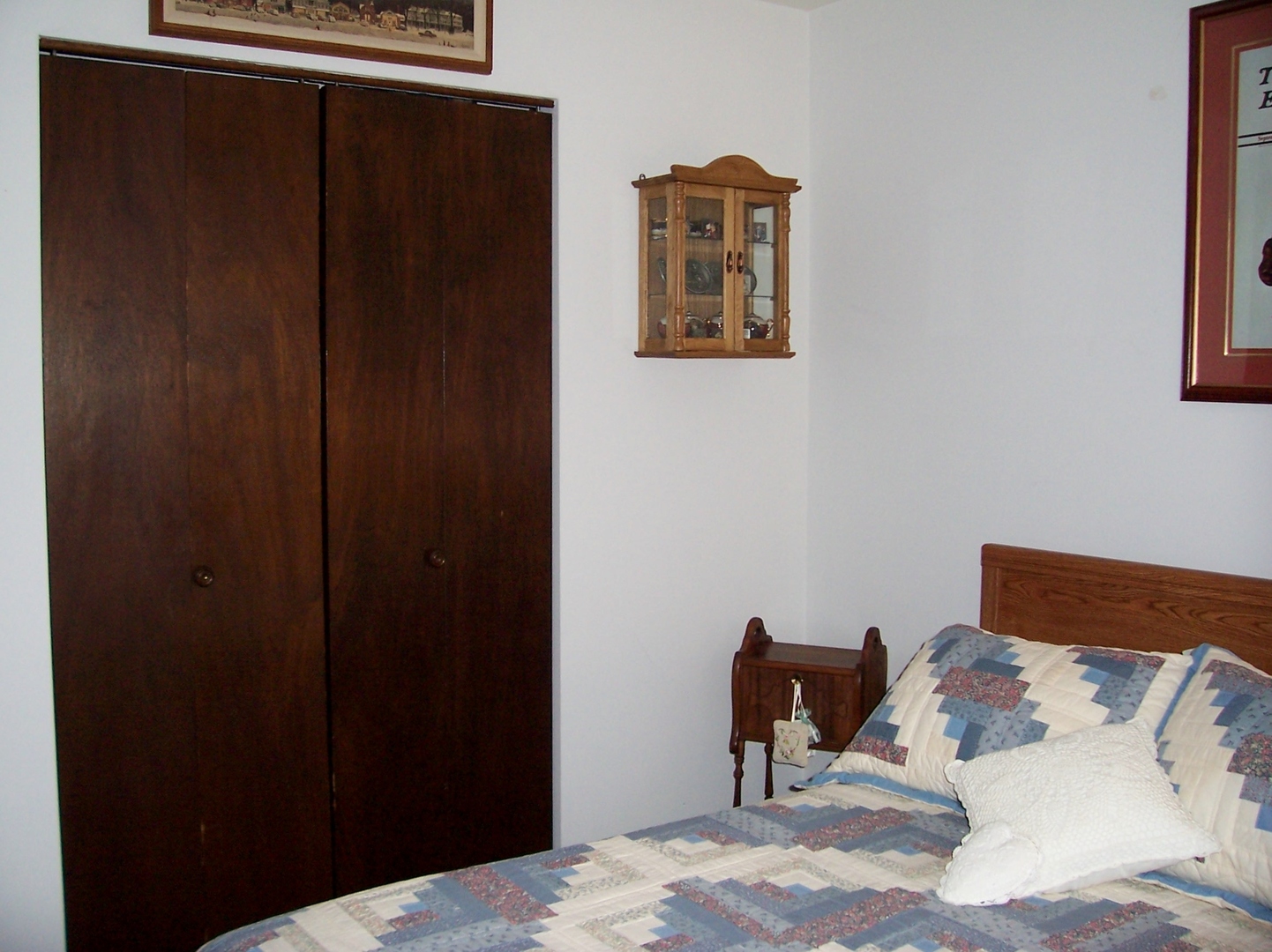 411 Lemont Street Lemont, IL 60439 - Photo 22 of 31 a bedroom with a bed and a table