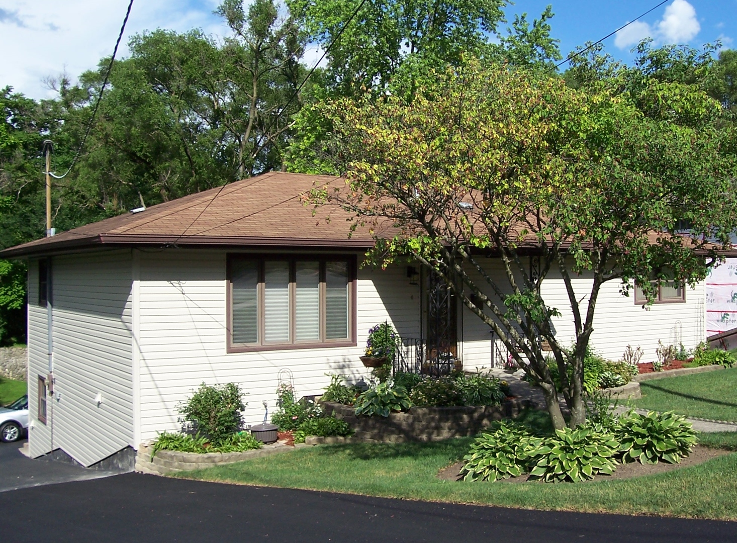 411 Lemont Street Lemont, IL 60439 - Photo 3 of 31 a view of house with outdoor space and garden
