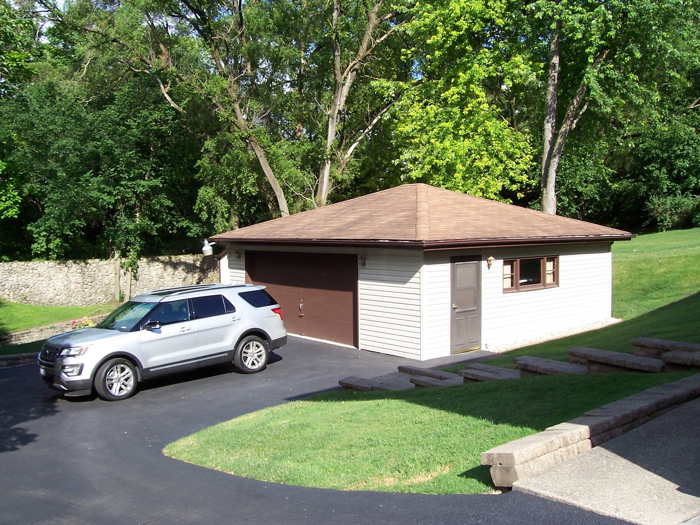 411 Lemont Street Lemont, IL 60439 - Photo 5 of 31 a car parked in the back of a house
