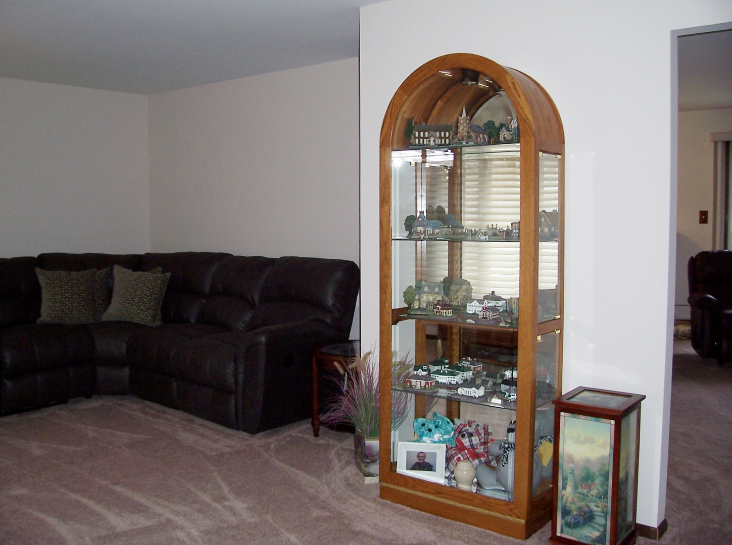 411 Lemont Street Lemont, IL 60439 - Photo 8 of 31 a living room with furniture a floor to ceiling window and a flat screen tv