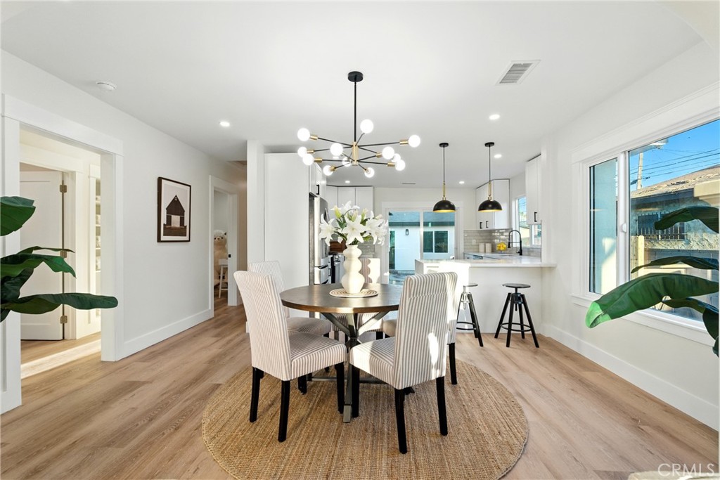 4340 2nd Avenue Los Angeles, CA 90008 - Photo 13 of 54 a view of a dining room with furniture and wooden floor