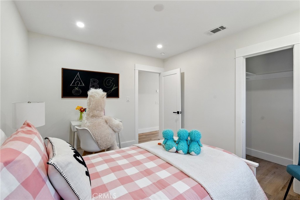 4340 2nd Avenue Los Angeles, CA 90008 - Photo 16 of 54 a bedroom with a bed and a couch