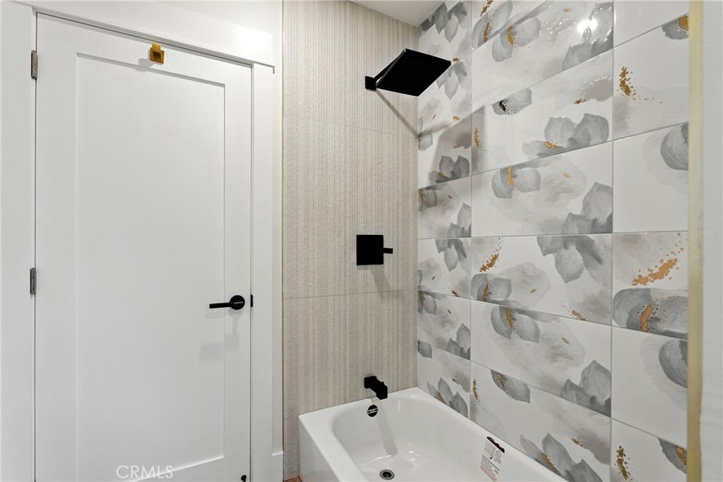 4340 2nd Avenue Los Angeles, CA 90008 - Photo 19 of 54 a bathroom with a sink and a shower