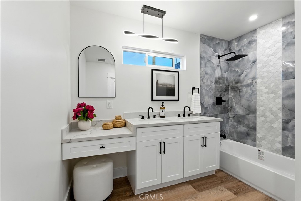 4340 2nd Avenue Los Angeles, CA 90008 - Photo 28 of 54 a bathroom with a sink mirror and a bathtub