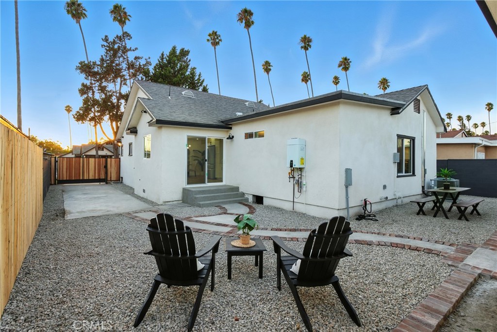 4340 2nd Avenue Los Angeles, CA 90008 - Photo 30 of 54 a view of a patio with table and chairs with potted plants
