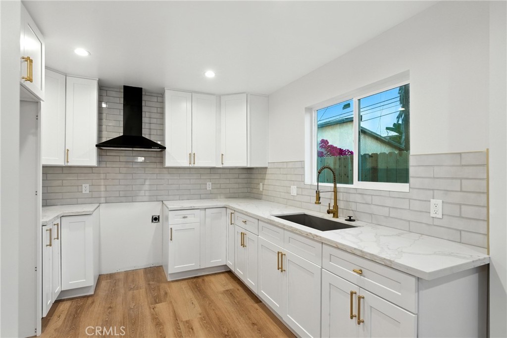 4340 2nd Avenue Los Angeles, CA 90008 - Photo 35 of 54 a kitchen with a sink and cabinets