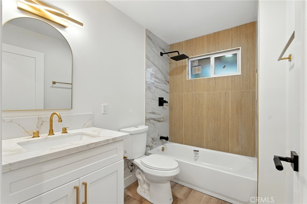 4340 2nd Avenue Los Angeles, CA 90008 - Photo 39 of 54 a bathroom with a sink a toilet and shower