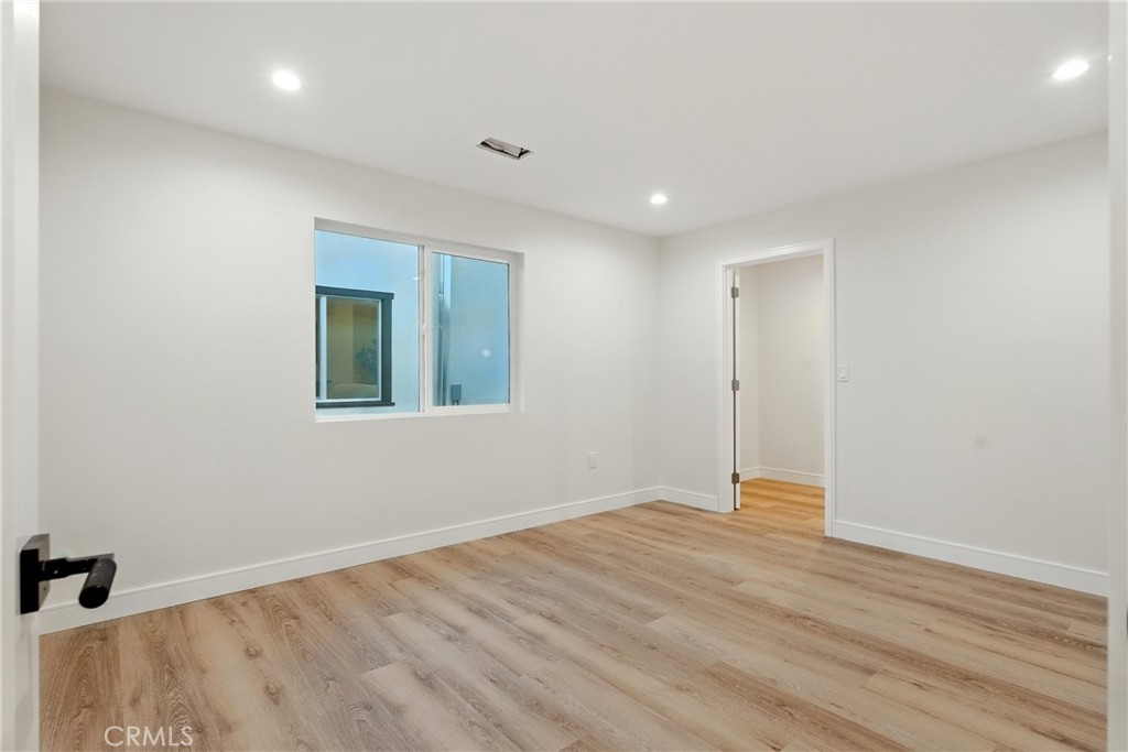 4340 2nd Avenue Los Angeles, CA 90008 - Photo 42 of 54 a view of an empty room with wooden floor and a window