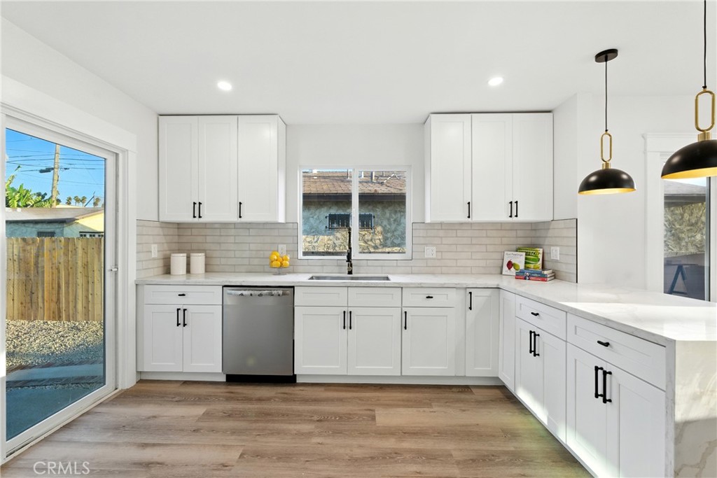 4340 2nd Avenue Los Angeles, CA 90008 - Photo 10 of 54 a kitchen with sink cabinets and window