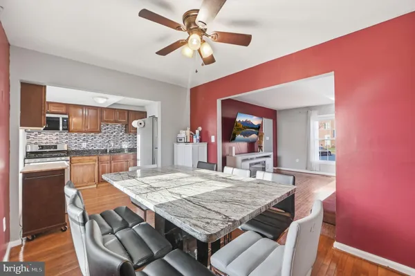 a dining room with a table and chairs