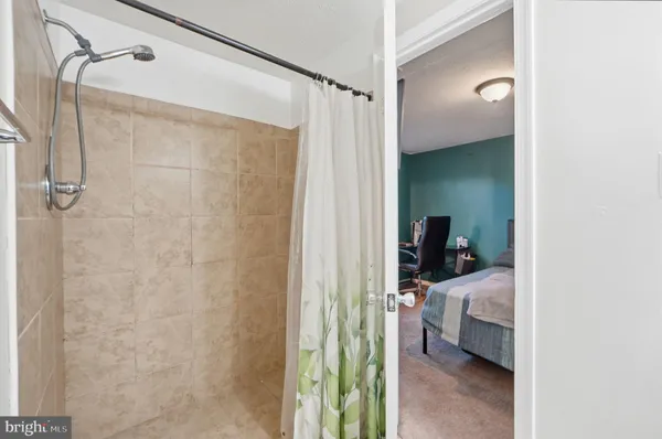 a en suite bathroom with a sink and a mirror