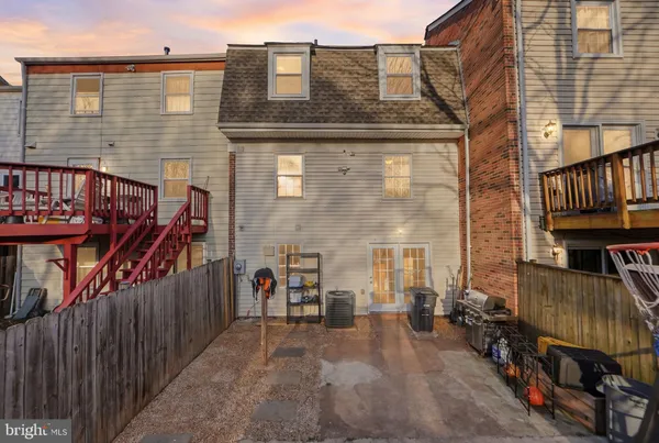 a view of a brick house with many windows