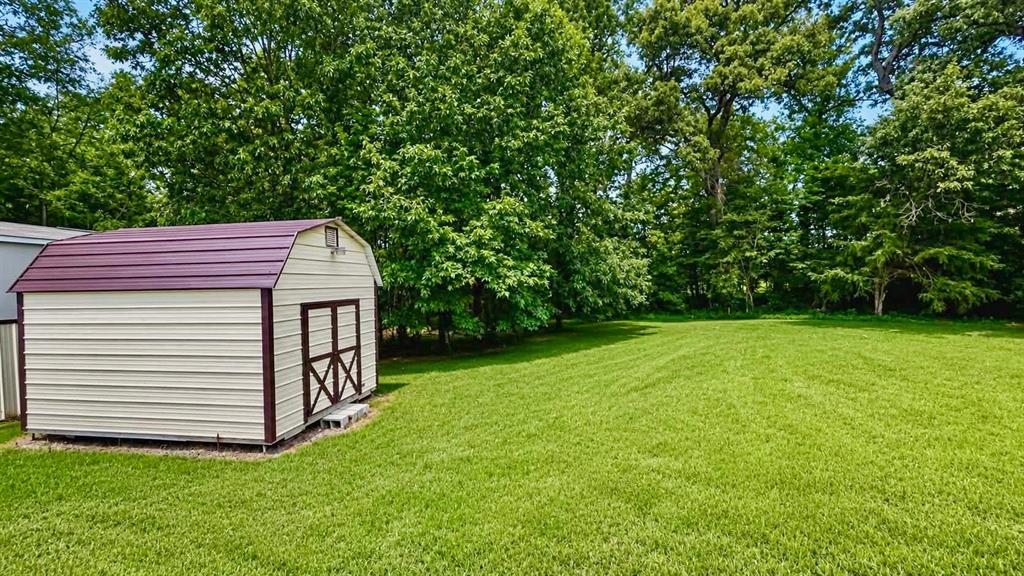 741 Waterfront Row Quitman, TX 75783 - Photo 24 of 40 a view of a backyard with a garden