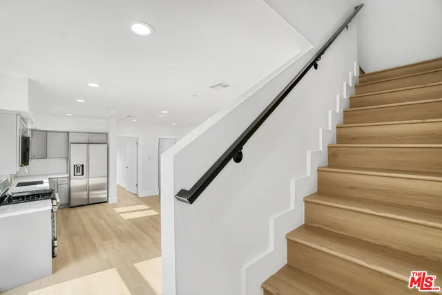 a view of entryway and kitchen