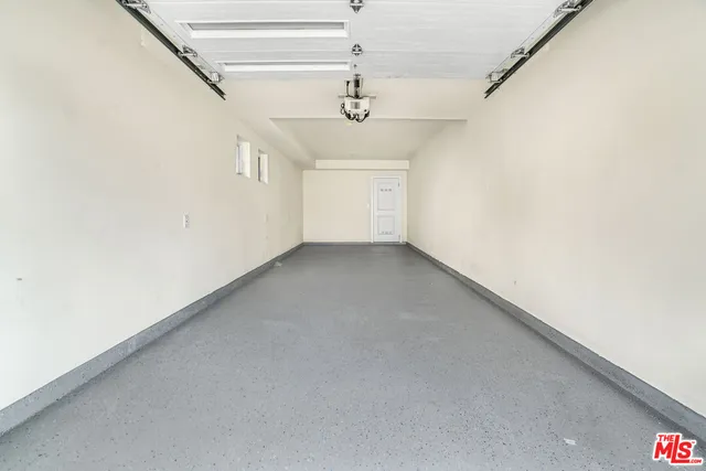 a view of a hallway with a chandelier