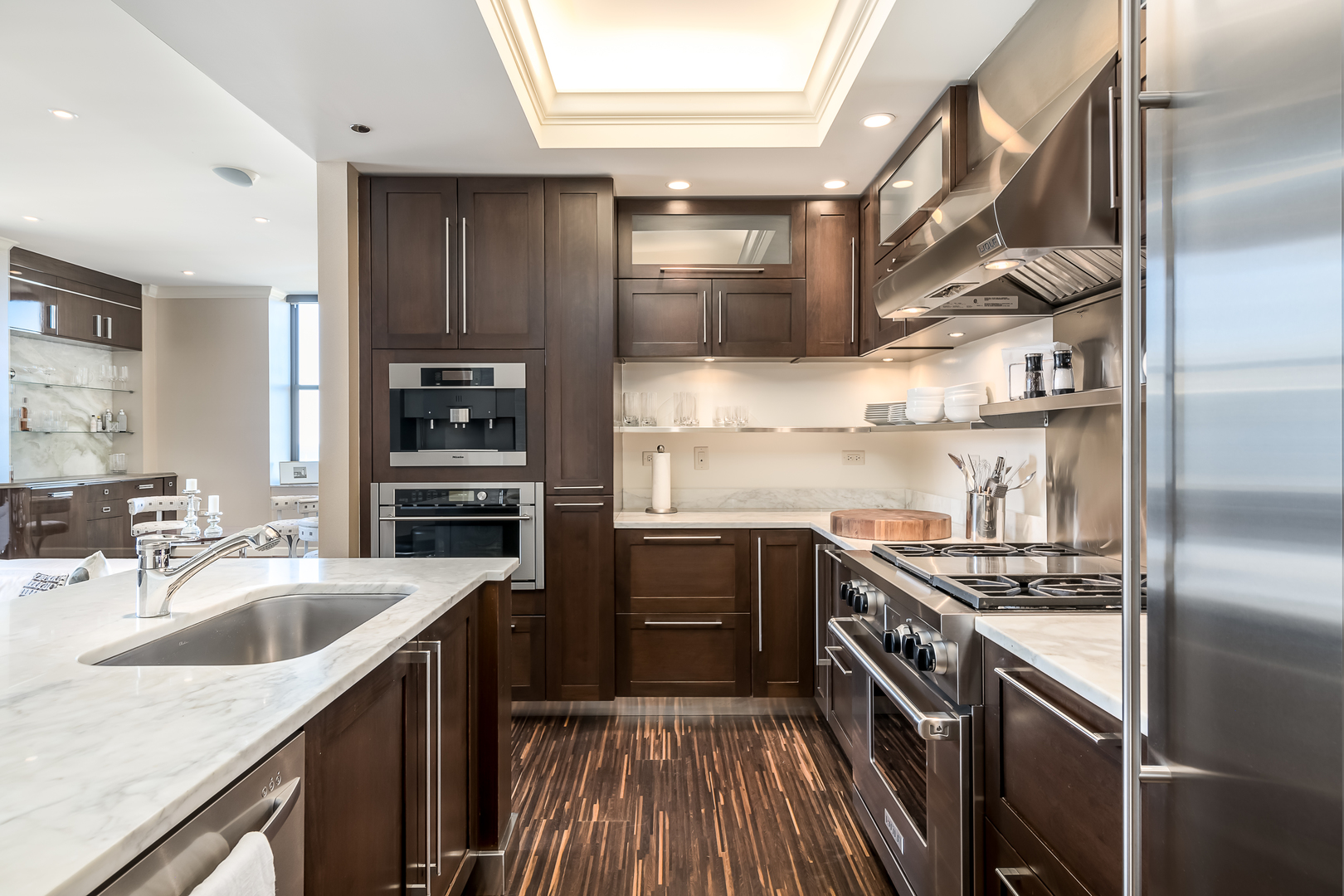 310 South Michigan Avenue, Unit 1900 Chicago, IL 60604 - Photo 13 of 29 a kitchen with stainless steel appliances granite countertop a sink stove and refrigerator