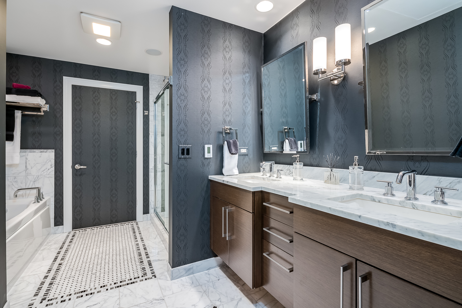 310 South Michigan Avenue, Unit 1900 Chicago, IL 60604 - Photo 17 of 29 a spacious bathroom with a sink double vanity granite and a shower