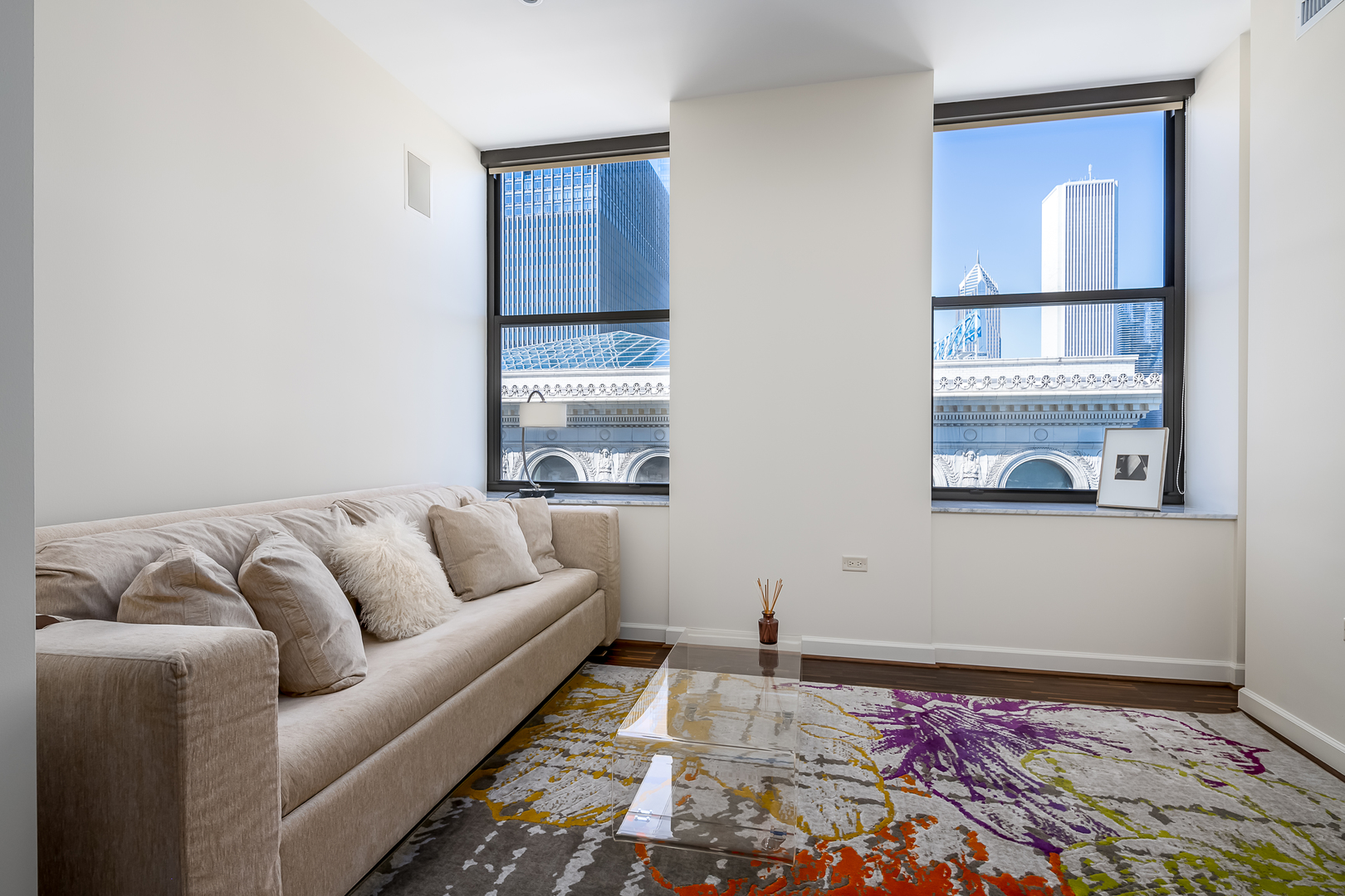 310 South Michigan Avenue, Unit 1900 Chicago, IL 60604 - Photo 23 of 29 a living room with furniture and a rug