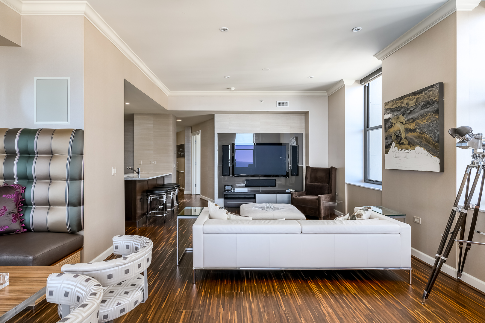 310 South Michigan Avenue, Unit 1900 Chicago, IL 60604 - Photo 9 of 29 a living room with furniture and a flat screen tv
