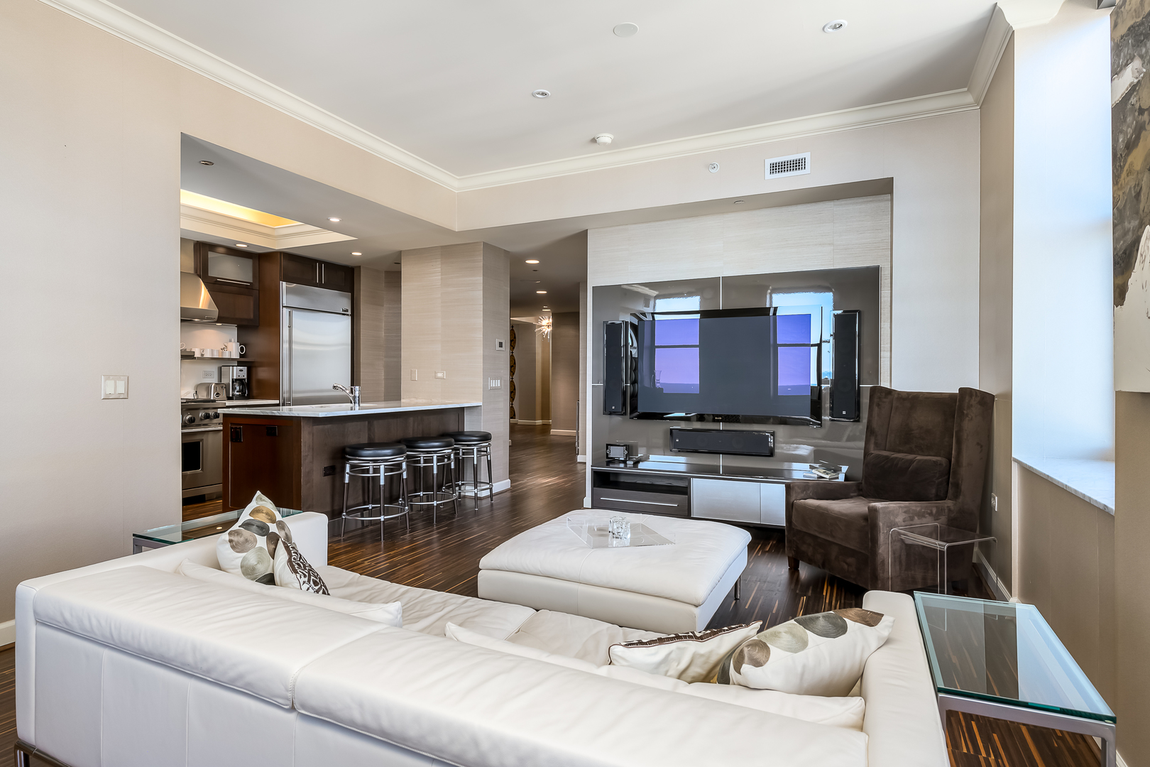 310 South Michigan Avenue, Unit 1900 Chicago, IL 60604 - Photo 10 of 29 a living room with furniture and a flat screen tv