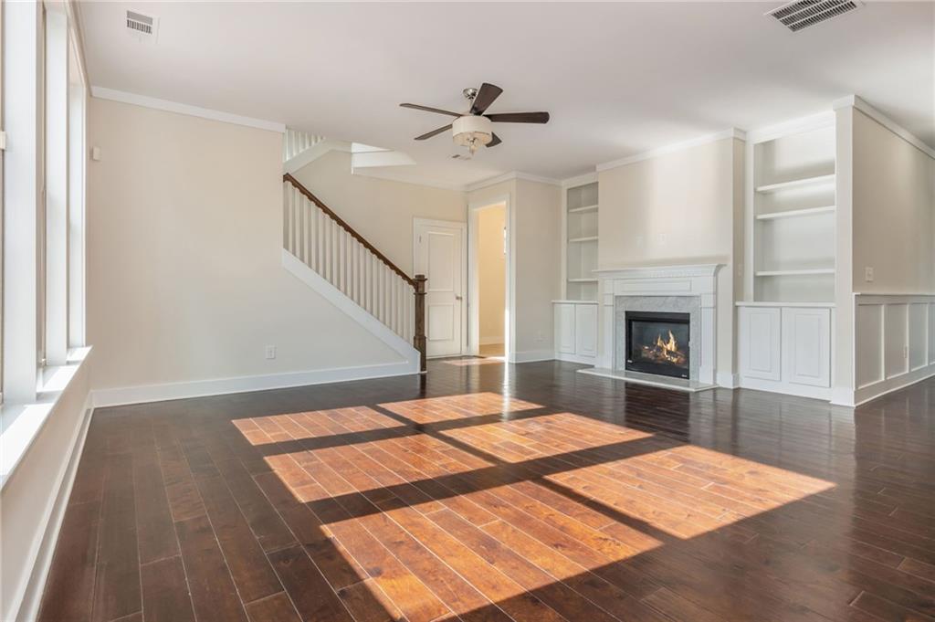 5914 High Hampton Lane Mableton, GA 30126 - Photo 13 of 32 a view of an empty room with wooden floor and a fireplace