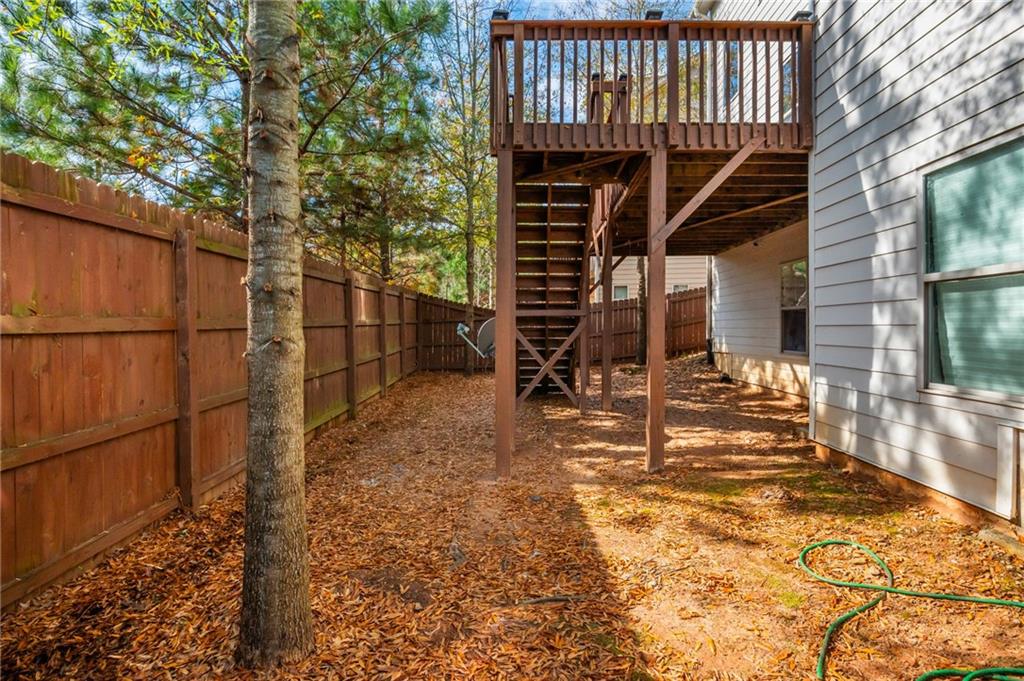 5914 High Hampton Lane Mableton, GA 30126 - Photo 32 of 32 a view of a backyard with wooden fence