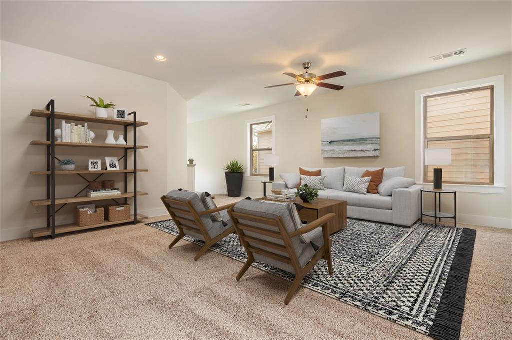 5914 High Hampton Lane Mableton, GA 30126 - Photo 7 of 32 a living room with furniture a ceiling fan and a rug