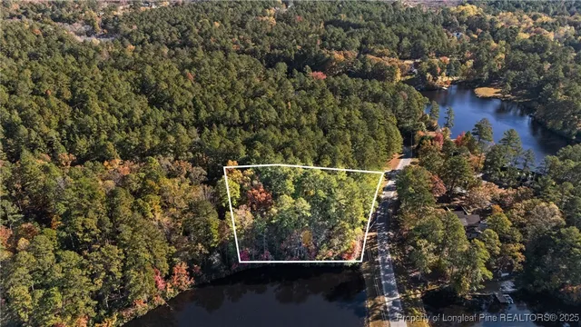 an aerial view of house with yard