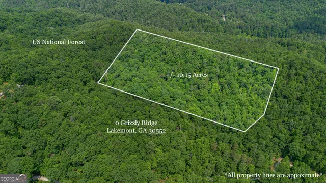 a view of a lush green hillside and houses