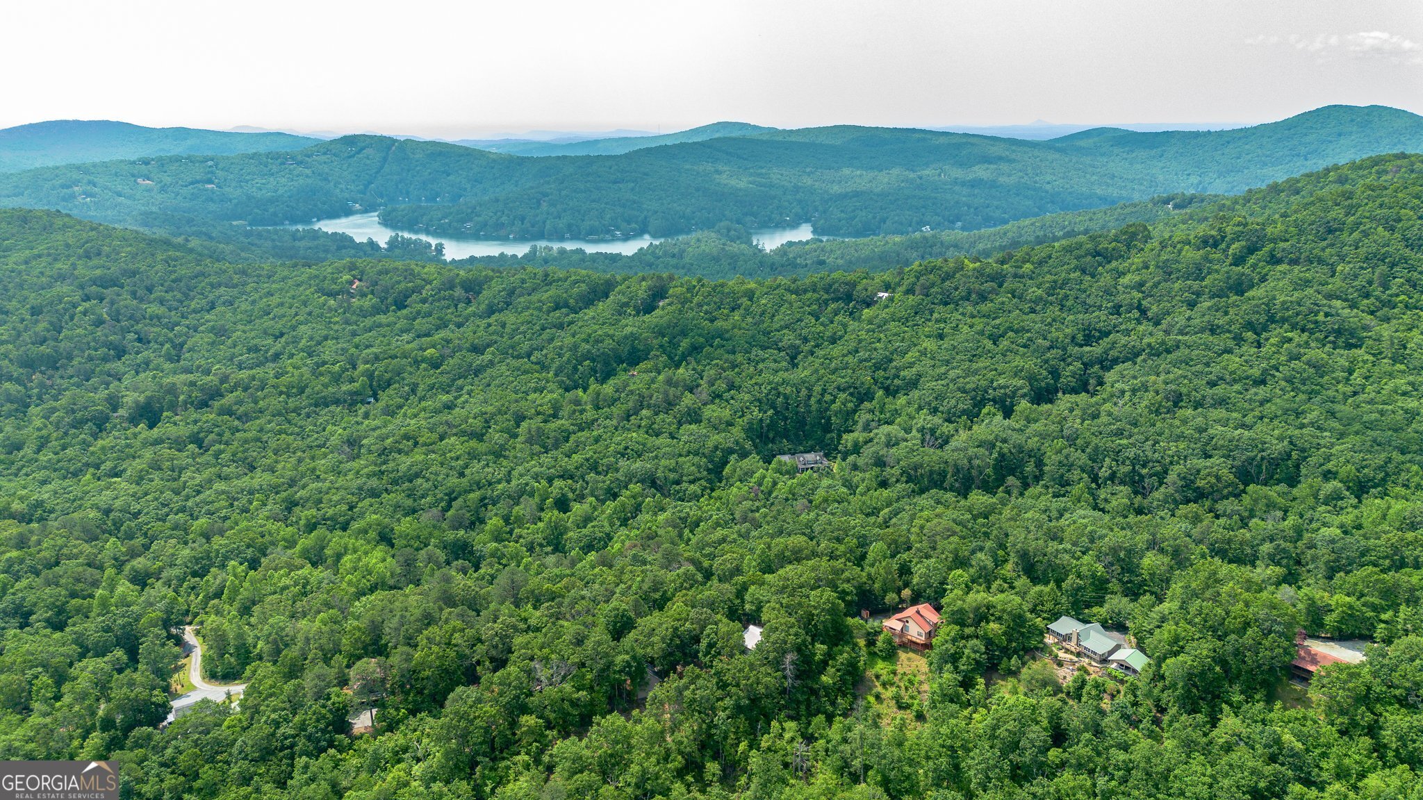 0 Grizzly Ridge Road Lakemont, GA 30552 - Photo 2 of 75 a view of a lush green hillside and houses