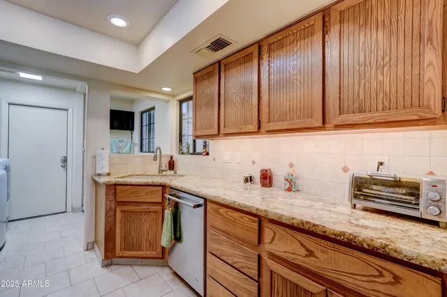 a bedroom with furniture and a fireplace