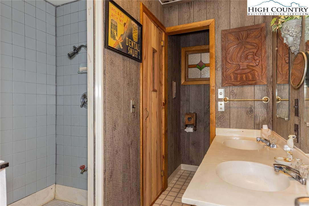 184 Birch Lane Deep Gap, NC 28618 - Photo 24 of 31 a bathroom with a sink and shower