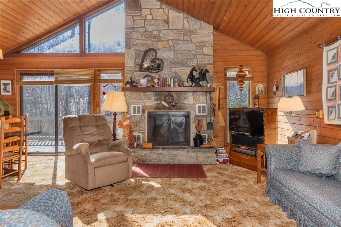 184 Birch Lane Deep Gap, NC 28618 - Photo 3 of 31 a living room with furniture and a fireplace