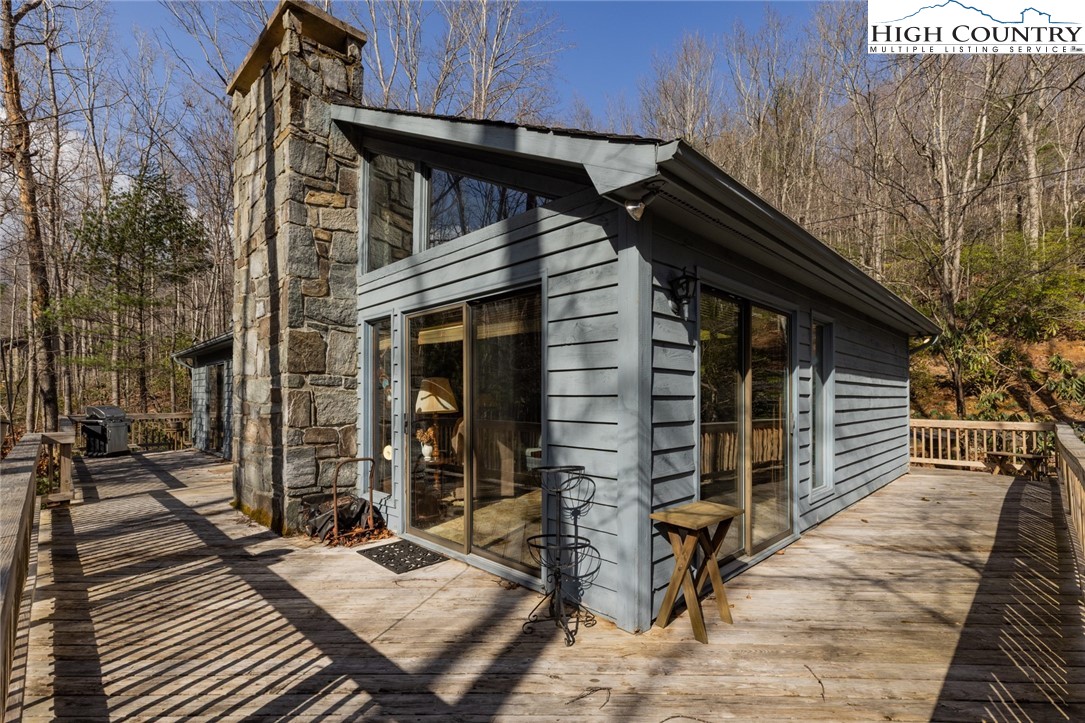 184 Birch Lane Deep Gap, NC 28618 - Photo 31 of 31 a view of house with wooden deck and furniture