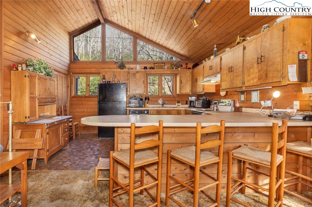 184 Birch Lane Deep Gap, NC 28618 - Photo 6 of 31 a view of a kitchen with a table and chairs