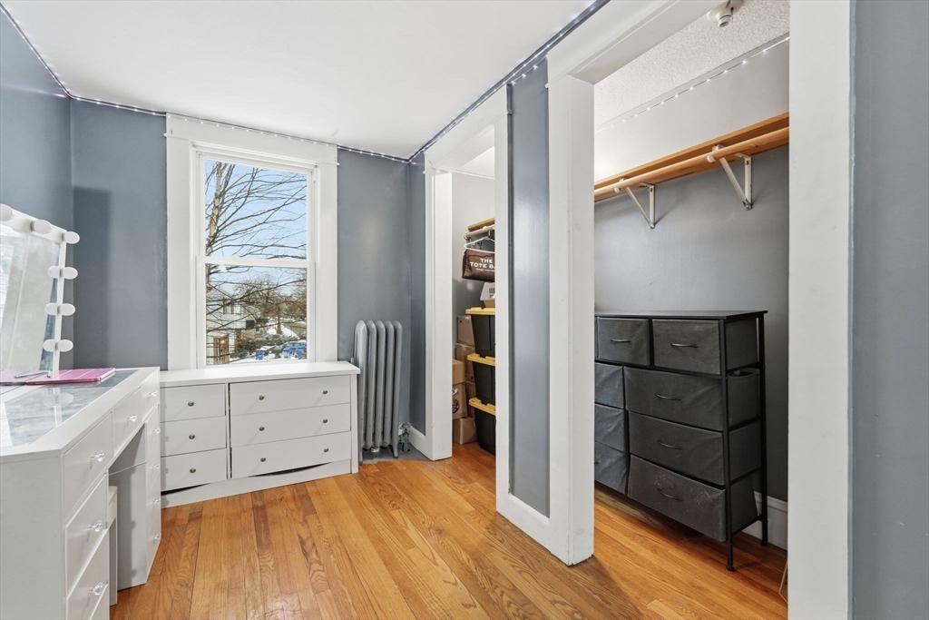 34 Savoy Avenue Springfield, MA 01104 - Photo 20 of 35 a room with a dresser and a window