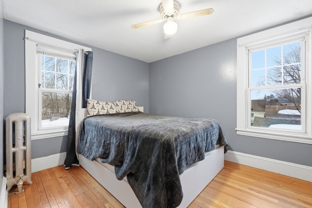 34 Savoy Avenue Springfield, MA 01104 - Photo 21 of 35 a bedroom with a large bed and a window