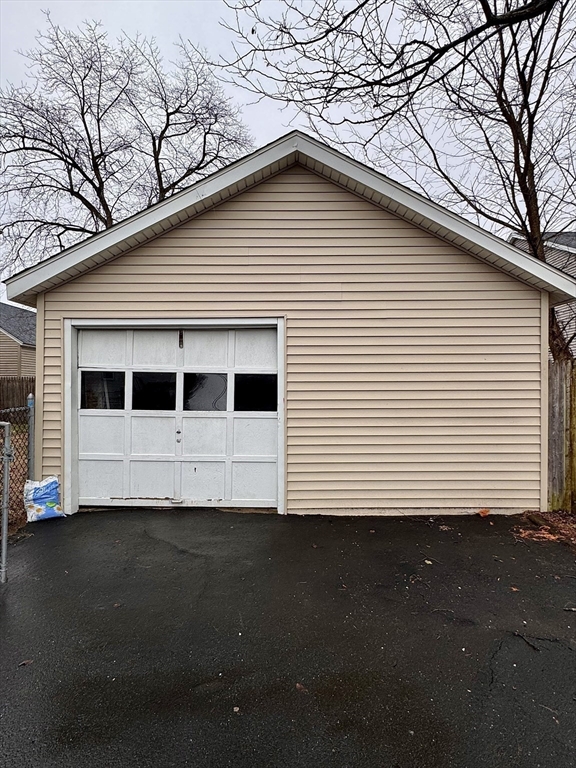 34 Savoy Avenue Springfield, MA 01104 - Photo 33 of 35 a front view of a house with a yard