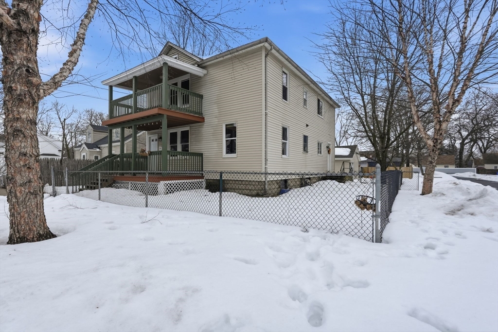 34 Savoy Avenue Springfield, MA 01104 - Photo 34 of 35 a view of house with a yard covered in snow