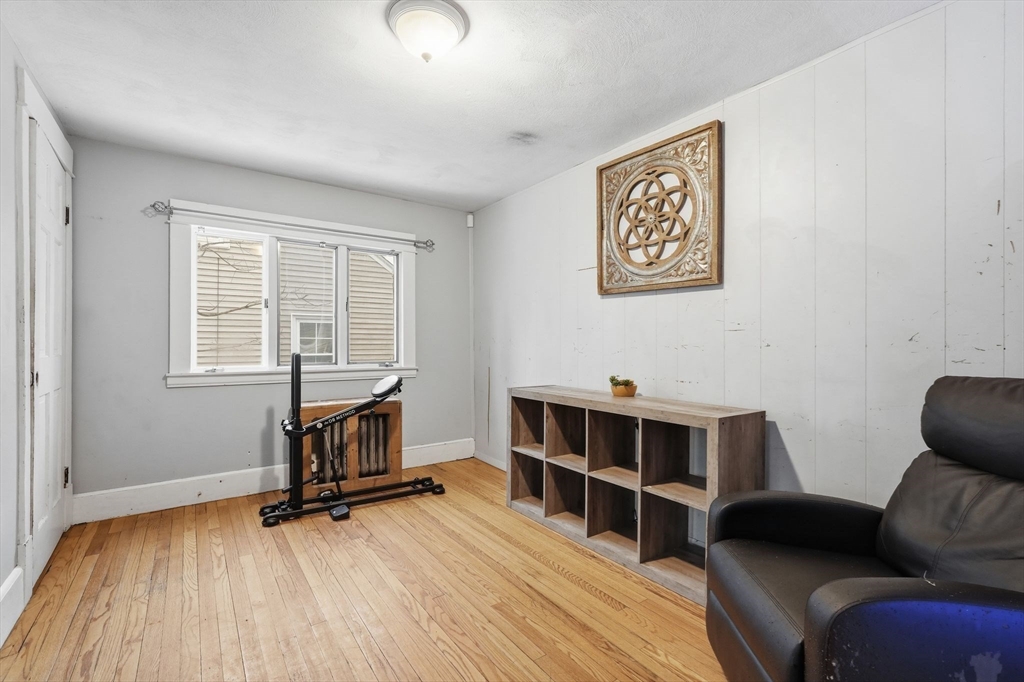 34 Savoy Avenue Springfield, MA 01104 - Photo 7 of 35 a room with furniture and a wooden floor