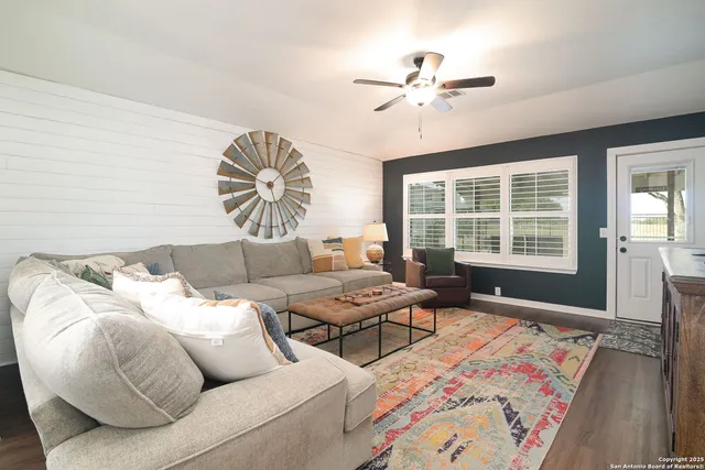 a living room with furniture and window