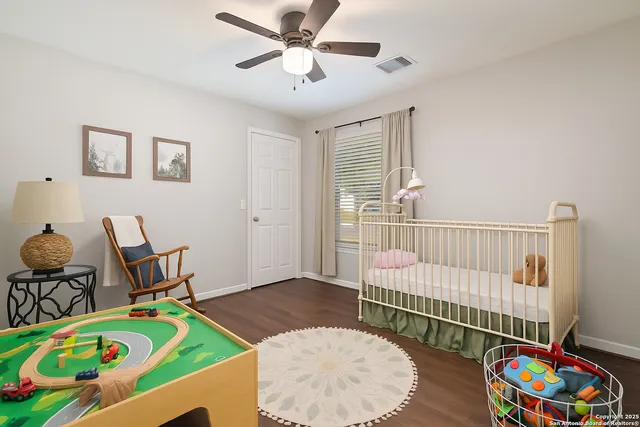 a bedroom with furniture and a window