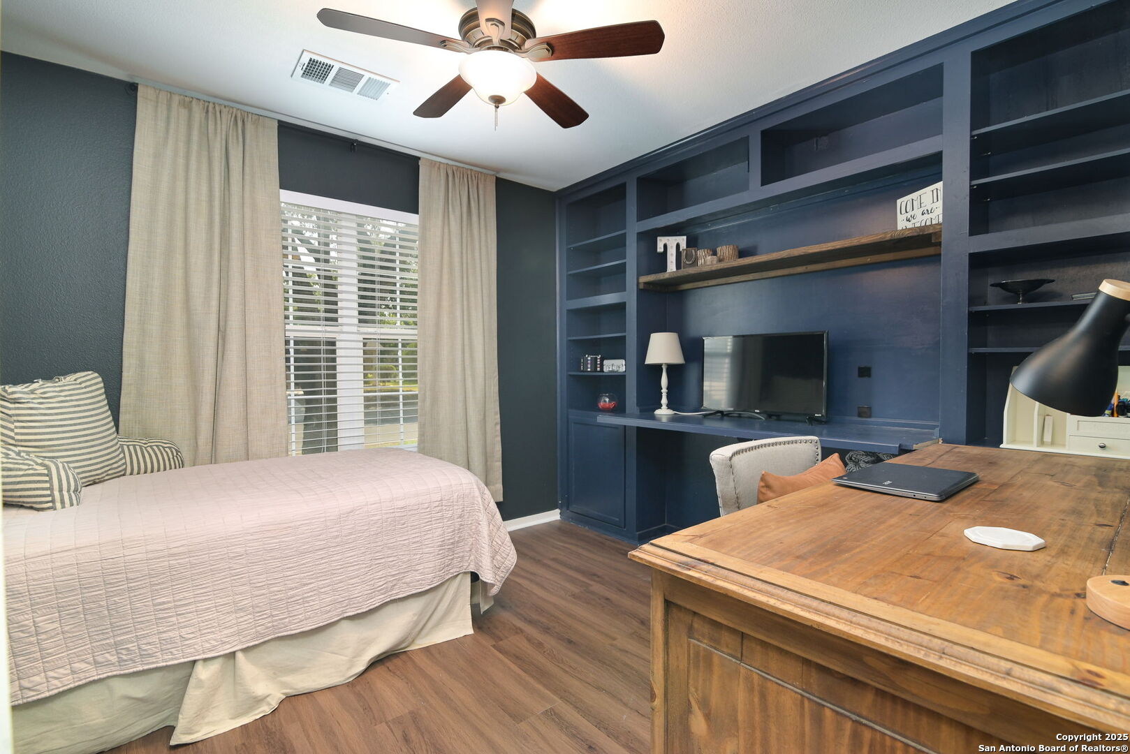 3796 Pebble Beach Cibolo, TX 78108 - Photo 5 of 21 a bedroom with a large bed and a chandelier