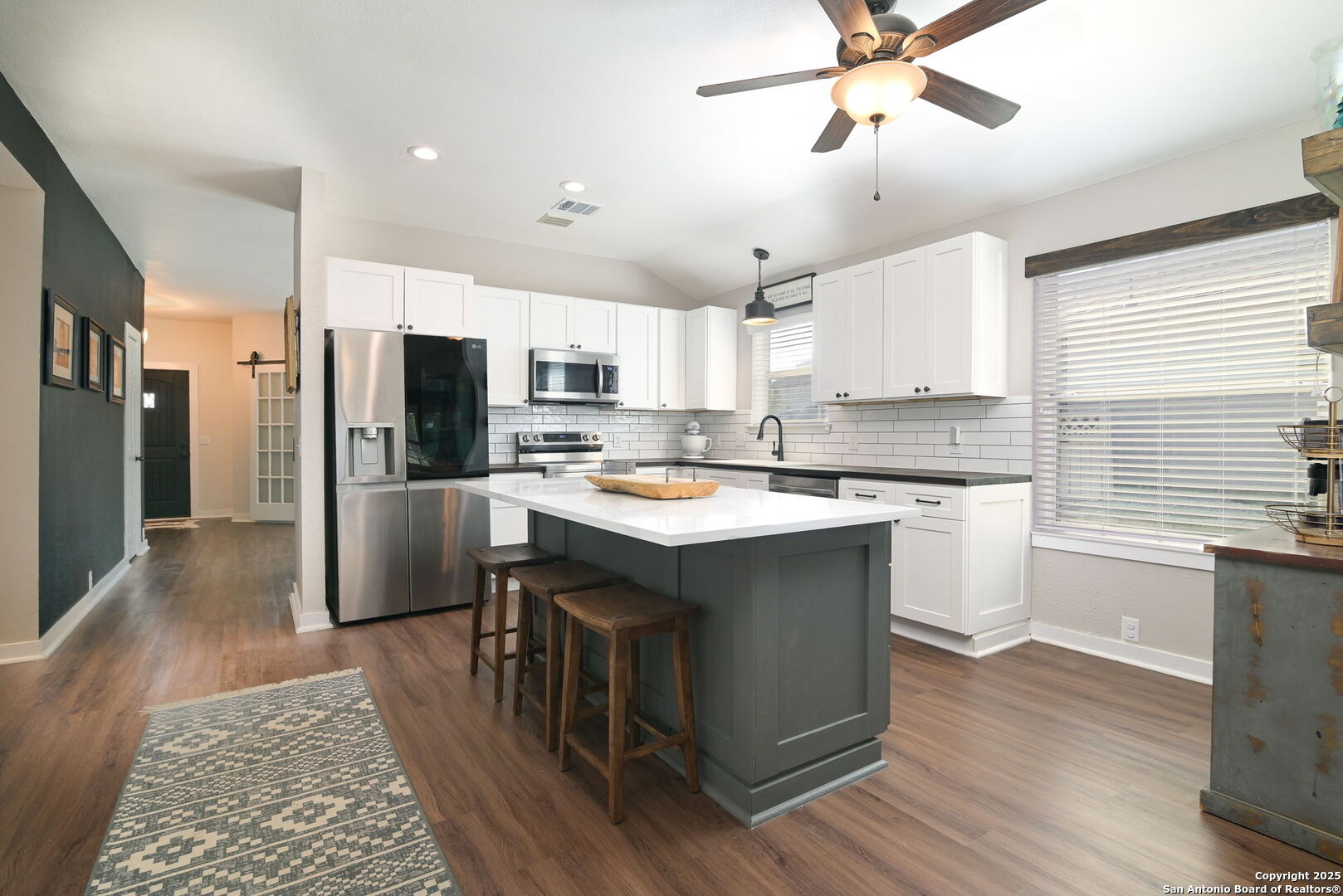 3796 Pebble Beach Cibolo, TX 78108 - Photo 8 of 21 a kitchen with kitchen island a sink appliances a counter space and a window