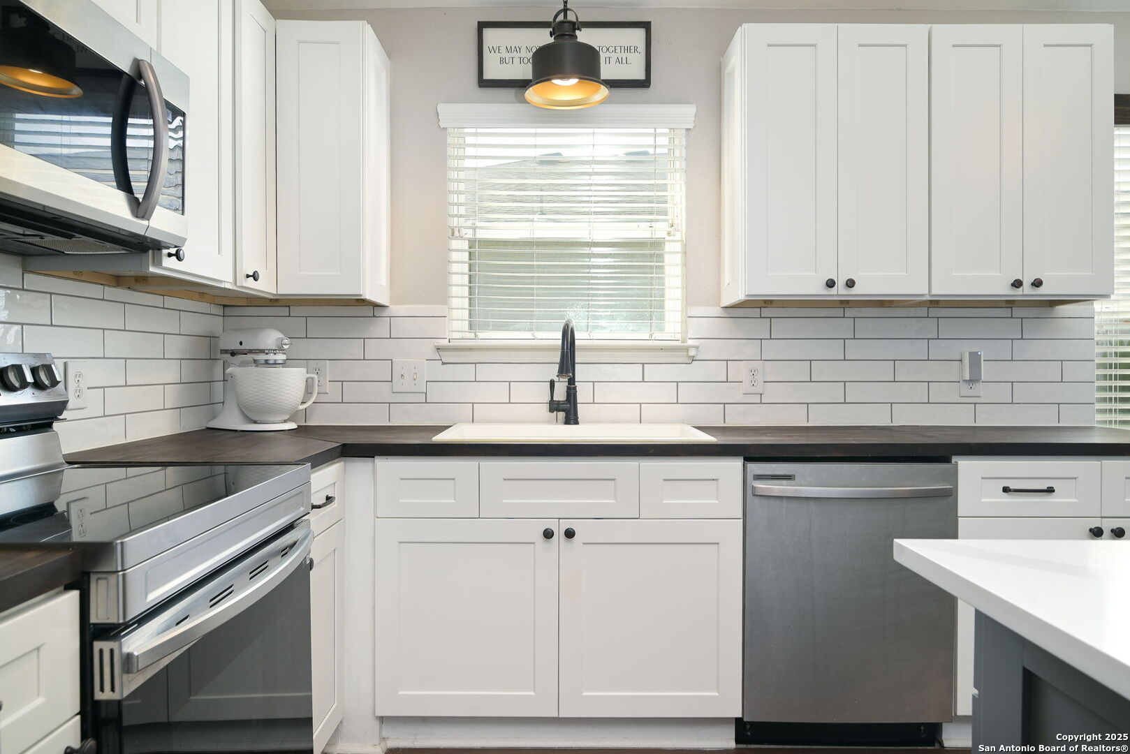3796 Pebble Beach Cibolo, TX 78108 - Photo 9 of 21 a kitchen with stainless steel appliances granite countertop a sink dishwasher a stove and cabinets