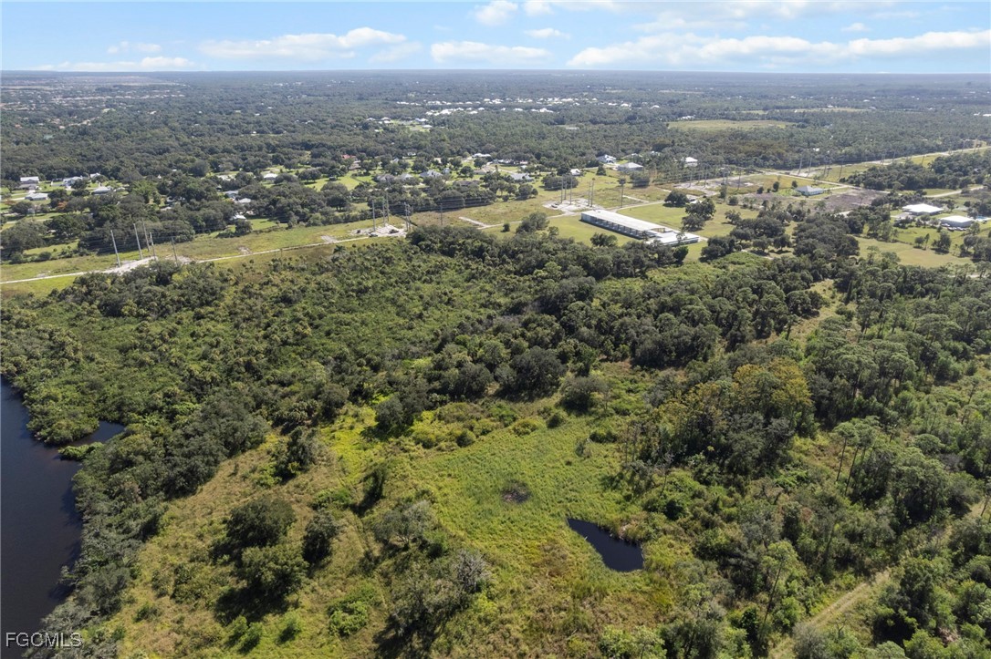 11281 Long Road Fort Myers, FL 33905 - Photo 14 of 24 an aerial view of residential houses with outdoor space and trees