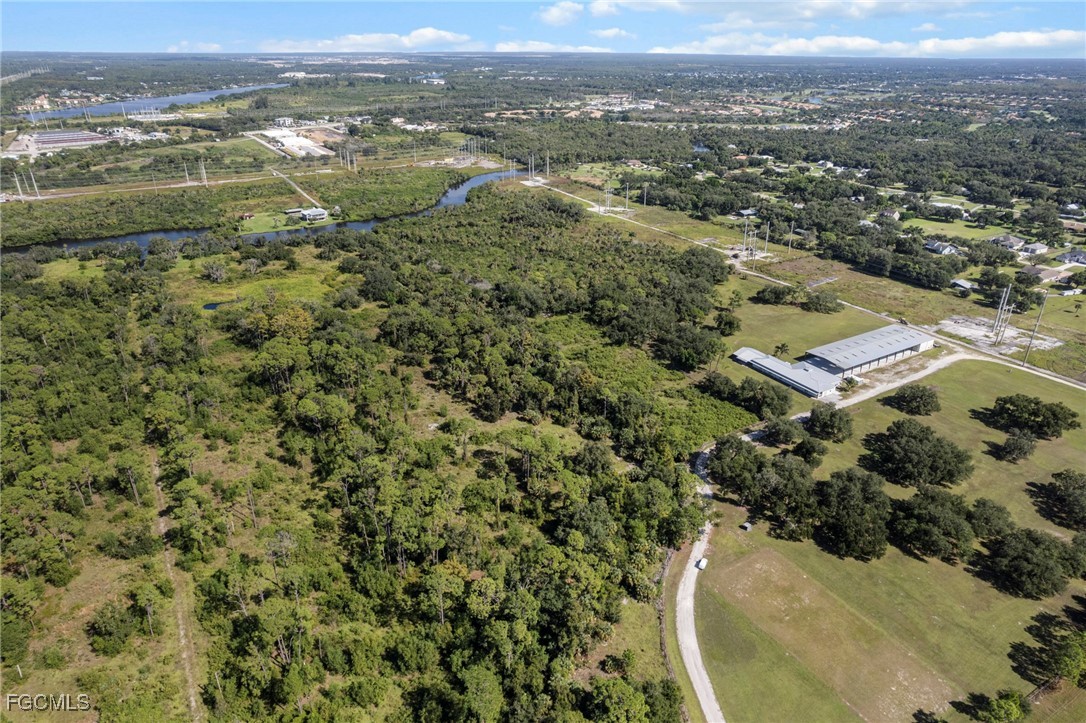 11281 Long Road Fort Myers, FL 33905 - Photo 17 of 24 an aerial view of residential houses with outdoor space and river